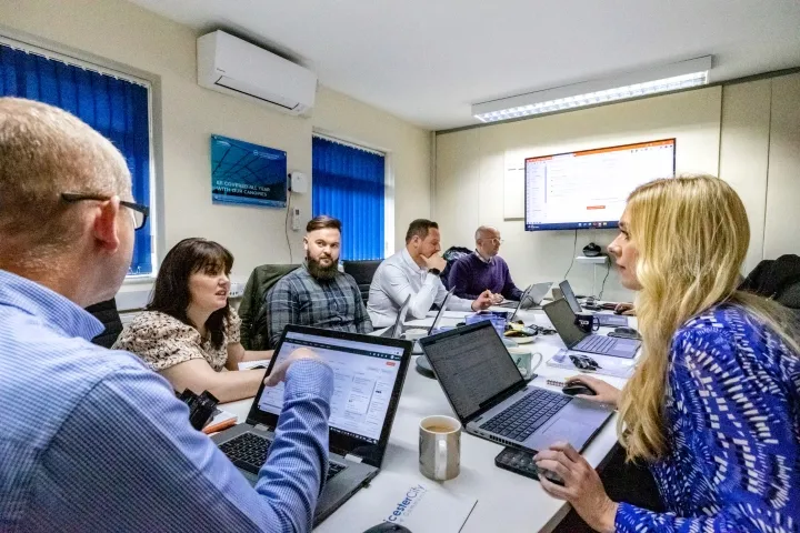 Martin Broadhurst delivering hands-on training to a seated team