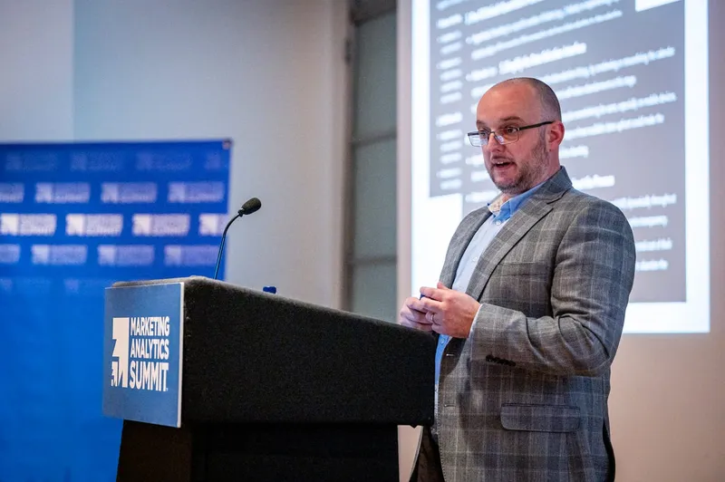 Martin Broadhurst presenting at the podium at MAS London
